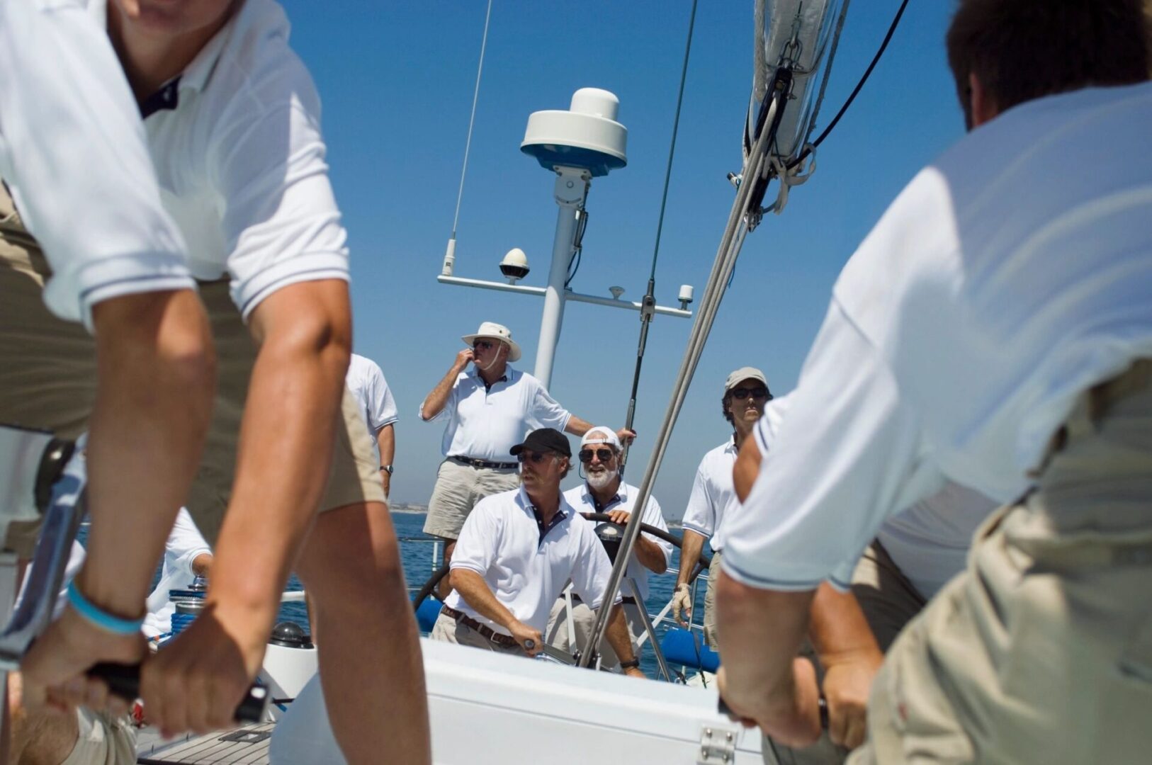 A group of people on a boat in the water.