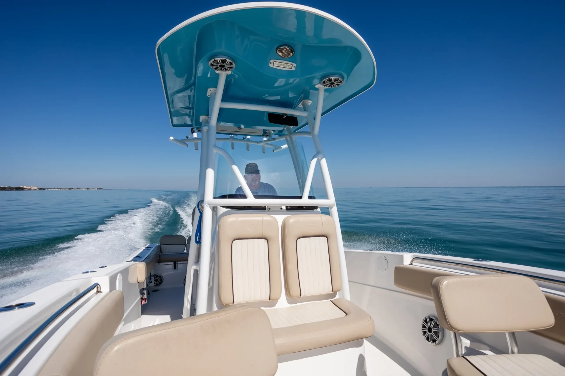 A boat with two seats and a canopy on it.