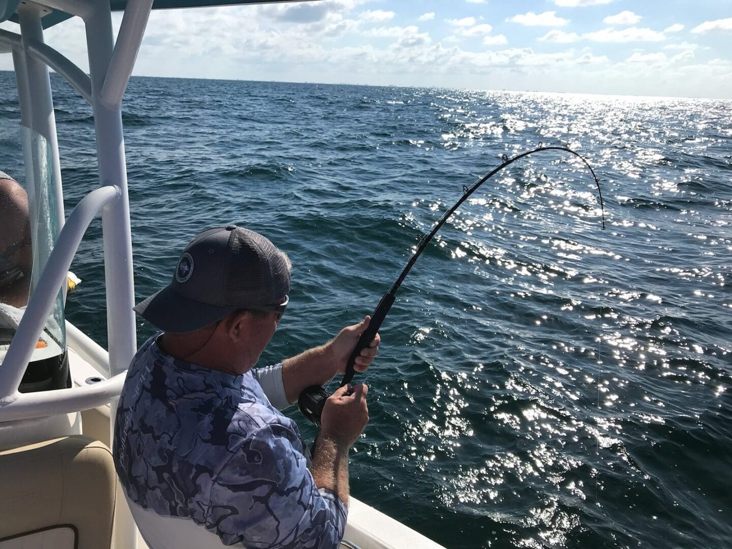 A man fishing on a boat