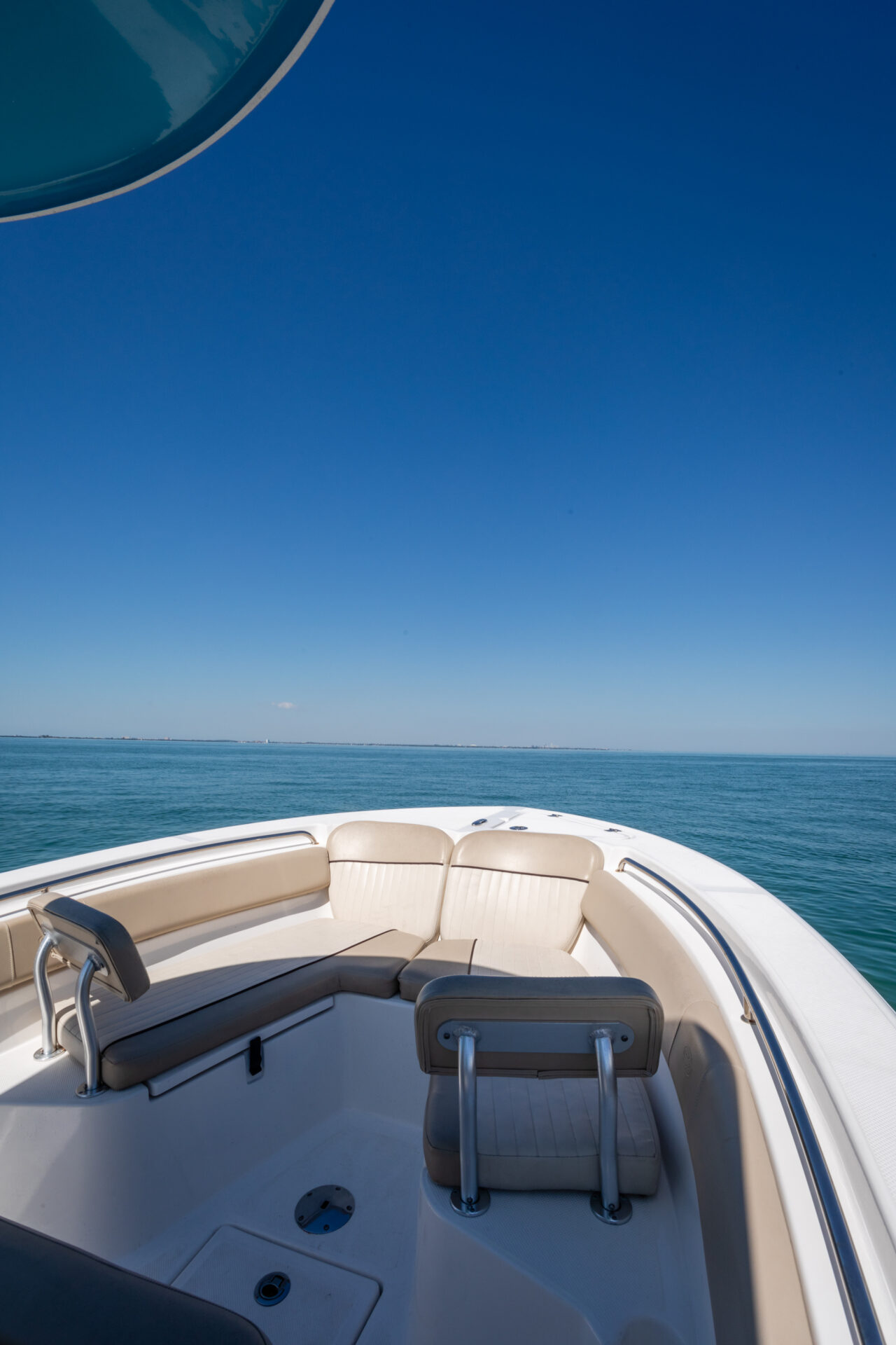 A boat is sitting in the water on the ocean.